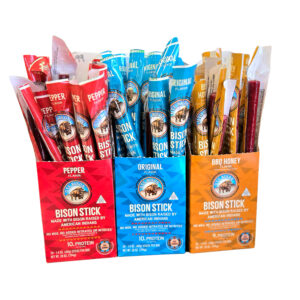 Three Ute Bison Jerky boxes with Original, Pepper, and Honey BBQ flavors on white background